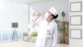 Beautiful medical woman doctor in uniform. Studio painted background. Concept of profitable health care.