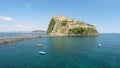 Beautiful medieval Aragonese Castle on volcanic island, turquois Gulf of Naples