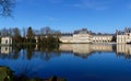 Beautiful Medieval landmark - royal hunting castle Fontainbleau with reflection in water of pond. Royalty Free Stock Photo