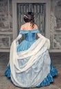 Beautiful medieval woman in blue dress, back Royalty Free Stock Photo