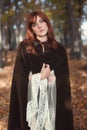 Beautiful medieval woman with brown cloak