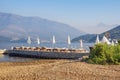 Beautiful Mediterranean landscape with beach umbrellas. Beach vacation concept. Montenegro, Bay of Kotor Royalty Free Stock Photo