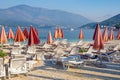 Beautiful Mediterranean landscape with beach umbrellas. Beach vacation concept. Montenegro, Kotor Bay Royalty Free Stock Photo