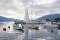 Beautiful Mediterranean landscape with boats on water on cloudy autumn day. Montenegro. Bay of Kotor near Tivat city Royalty Free Stock Photo