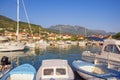 Beautiful Mediterranean landscape. Fishing boats in harbor on sunny summer day. Montenegro,  Bay of Kotor. Tivat city Royalty Free Stock Photo