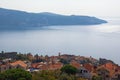 Beautiful Mediterranean landscape. Montenegro. View of Bay of Kotor, Lustica peninsula and red roofs of Herceg Novi city Royalty Free Stock Photo