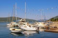 Sailboats and fishing boats on water. Montenegro, Bay of Kotor