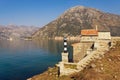 Beautiful Mediterranean landscape on sunny spring day. Montenegro. View of Kotor Bay and ancient Church of Our Lady of Angels Royalty Free Stock Photo