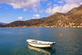 Beautiful Mediterranean landscape on sunny winter day.  Montenegro, Adriatic Sea. View of Kotor Bay and fishing boat on water Royalty Free Stock Photo