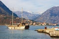 Beautiful Mediterranean landscape on sunny winter day. Montenegro, Bay of Kotor, Dobrota town. Prcanj town in distance