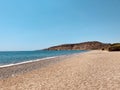 Beautiful Mediterranean landscape. View of empty wild beach and clear turquoise water of Mediterranean sea. Cyprus. Royalty Free Stock Photo