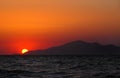Beautiful mediterranean sunset over over the island of kos with an orange evening sky and light reflected in a dark calm sea Royalty Free Stock Photo