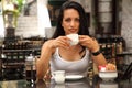 Beautiful mediterranean woman drinking coffee Royalty Free Stock Photo