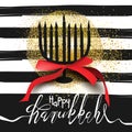 Beautiful menorah silhouette on black and white striped background with golden glitter Royalty Free Stock Photo