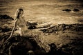 Beautiful Mermaid on Lava Rocks black and white image