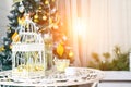 Beautiful Merry Christmas interior. White bird cage and candles Royalty Free Stock Photo