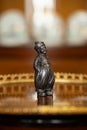 Beautiful metal antique figurine of a boy in a renaissance style interior