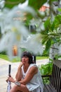 Unhappy girl sitting at bench