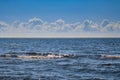 Beautiful midday blue sea sky clouds and waves Royalty Free Stock Photo