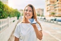 Beautiful middle age hispanic woman smiling sending a voice message on the phone happy outdoors Royalty Free Stock Photo