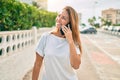 Beautiful middle age hispanic woman smiling speaking on the phone happy outdoors Royalty Free Stock Photo