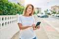 Beautiful middle age hispanic woman smiling using smatphone happy outdoors Royalty Free Stock Photo