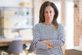 Beautiful middle age senior woman standing skeptic and nervous, disapproving expression on face with crossed arms Royalty Free Stock Photo