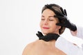 Beautiful middle age woman getting ready for eyelid lift plastic surgery doctor hands in black gloves point fingers to her face Royalty Free Stock Photo