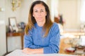 Beautiful middle age woman at home with serious expression on face Royalty Free Stock Photo