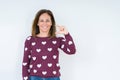 Beautiful middle age woman wearing heart sweater over isolated background smiling and confident gesturing with hand doing size
