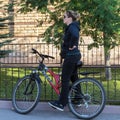 A beautiful middle-aged German woman with a beautiful figure rides a high-speed bike Royalty Free Stock Photo