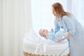 Happy middle aged mother with her child in a bedroom Royalty Free Stock Photo