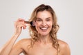 Beautiful Middle Aged Woman Applying Blush On Face With Makeup Brush Royalty Free Stock Photo