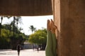 Beautiful middle-aged woman doing yoga in the street. Detail of feet and legs. The woman is doing relaxation and tranquility Royalty Free Stock Photo