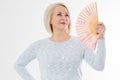 Beautiful middle aged woman with menopause blowing by fan. Hormone replacement therapy and mature woman healthcare. Mid age happy