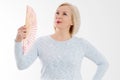 Beautiful middle aged woman with menopause blowing by fan. Hormone replacement therapy and mature woman healthcare. Mid age happy Royalty Free Stock Photo