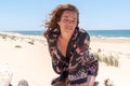 Beautiful middle aged woman in sand desert beach in summer day