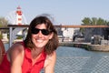 Beautiful middle aged woman on vacation in Summer concept in La Rochelle harbor France