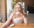 Beautiful millennial couple on date at cafe, drinking coffee, enjoying each other`s company Royalty Free Stock Photo