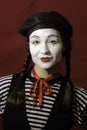 Beautiful mime girl smiling, looking at the camera