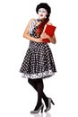Beautiful mime in spotty dress holdingr red book