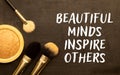 Beautiful minds inspire others. Text on notebook on a white background close-up Royalty Free Stock Photo