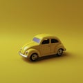 A beautiful mini yellow toy car for kids on a yellow background