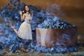 Beautiful miniature woman in waves of blue lavender sccent Royalty Free Stock Photo