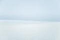 A beautiful, minimalist landscape of flat, snowy Norwegian field.