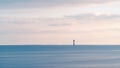 Seascape at sunset with Chauveau lighthouse. Rivedoux, Re Island, France Royalty Free Stock Photo