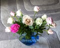 Mixed Color Roses in a blue valse.