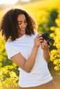 Beautiful Mixed Race African American Girl Teenager Using Camera Royalty Free Stock Photo