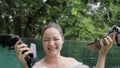 A beautiful mixed-race girl in a luxurious dress having fun in the pool throwing away her shoes and diving for them