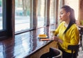 Beautiful mixed race teenage girl in coffee shop Royalty Free Stock Photo